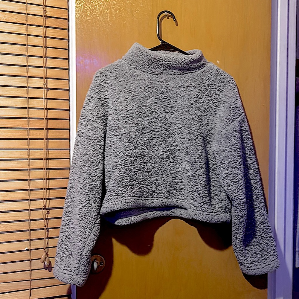 It’s a crop gray fluffy coat